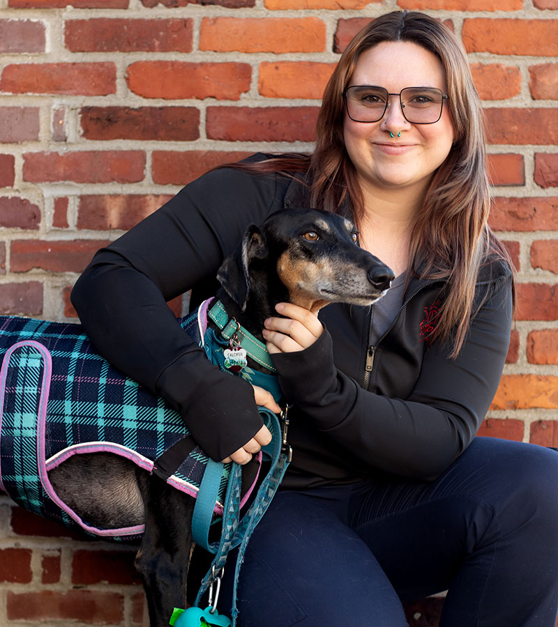 women playing with pet