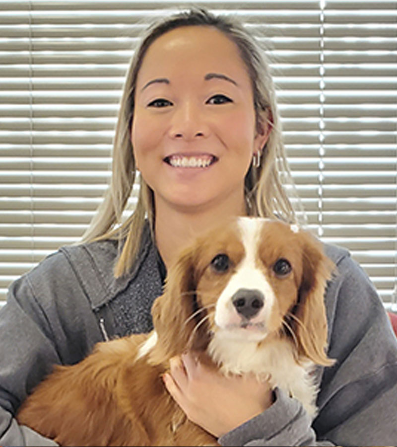 women holding the pet smiling